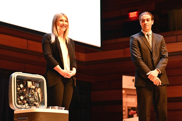 Karina Bland and James Hantho stand on stage.