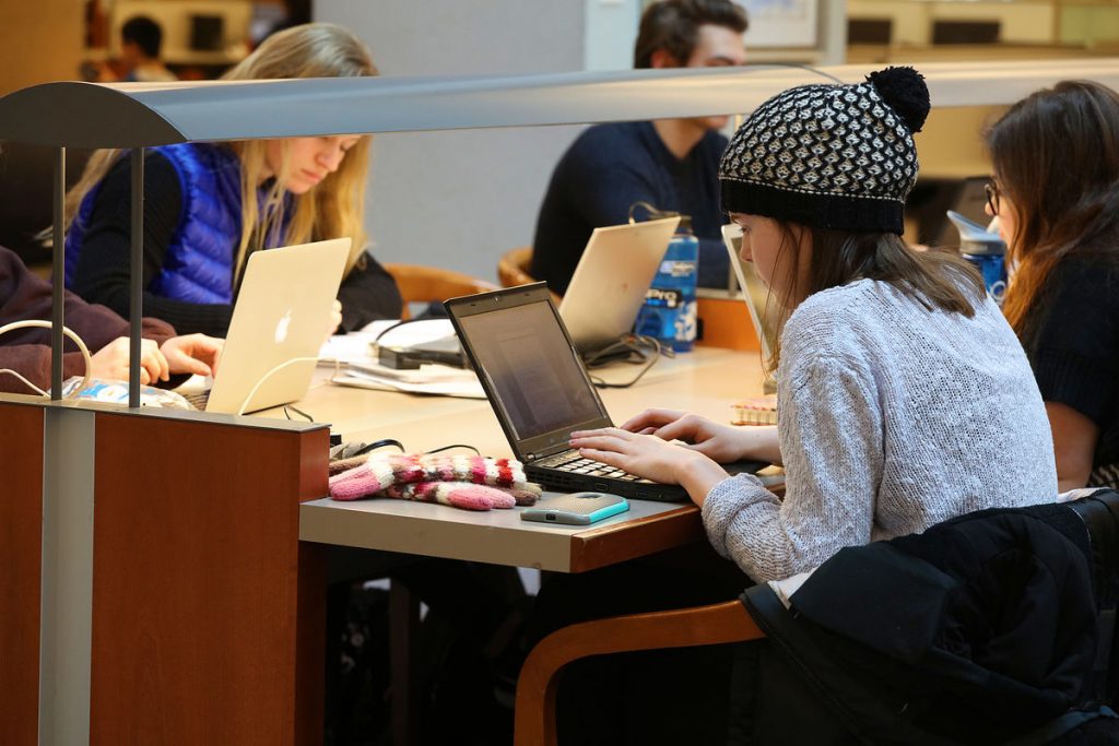 Student works on a laptop.