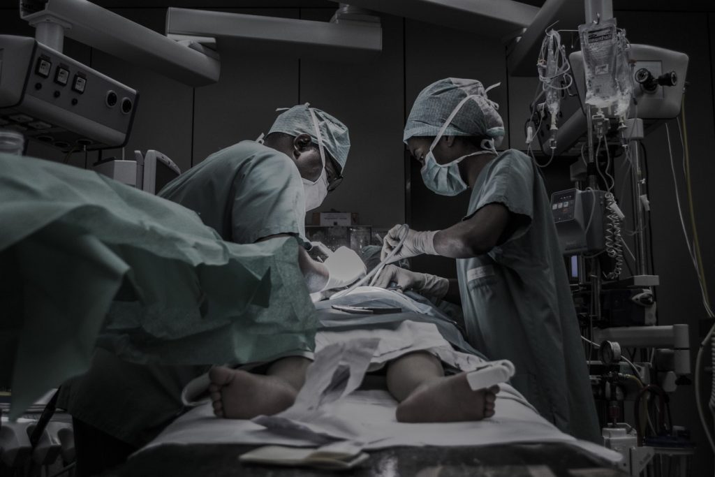 Doctors in operating room.